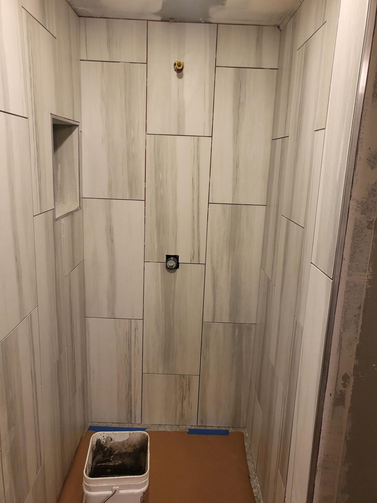 Wood-look plank tile shower walls